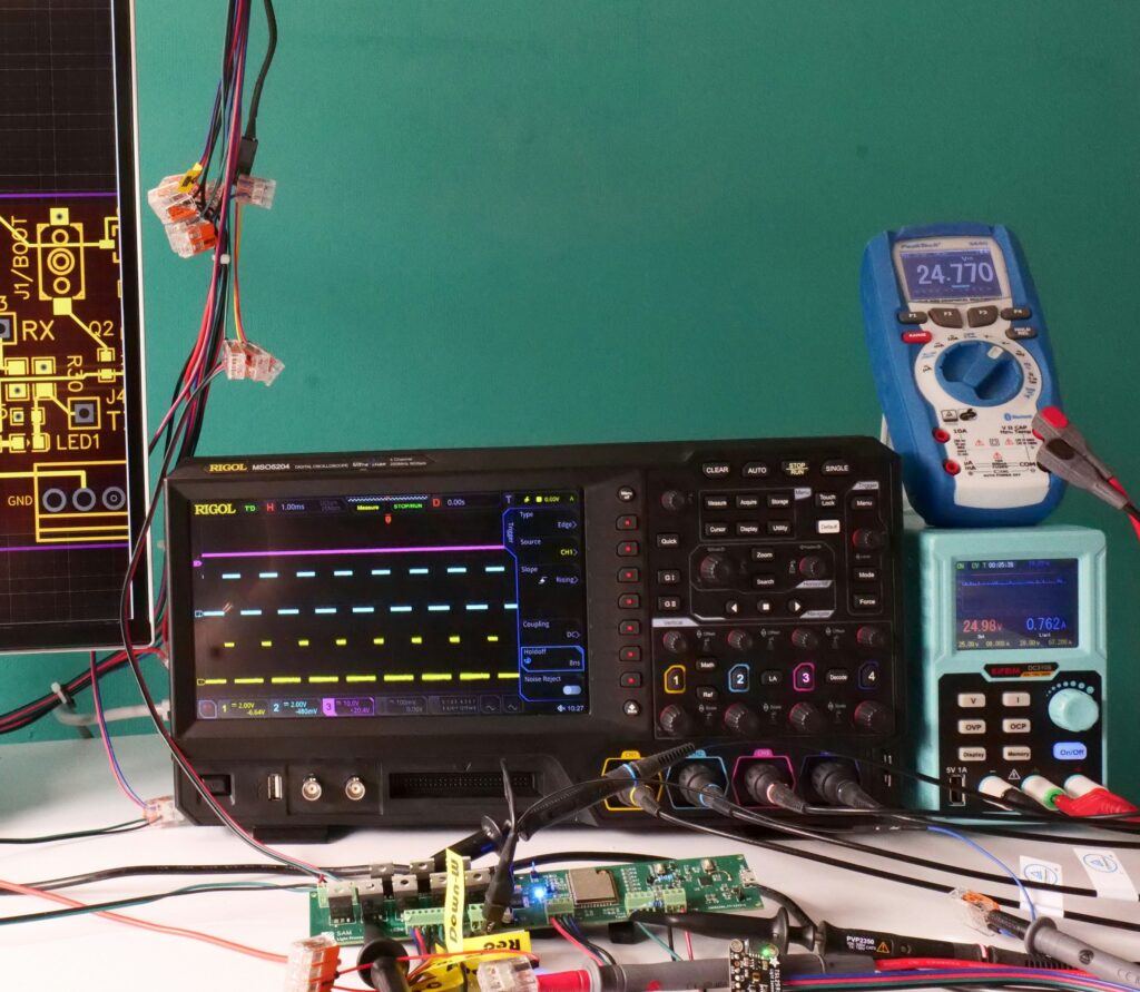 Electronics development and validation platform with PCB hardware, oscilloscope and laboratory test equipment.